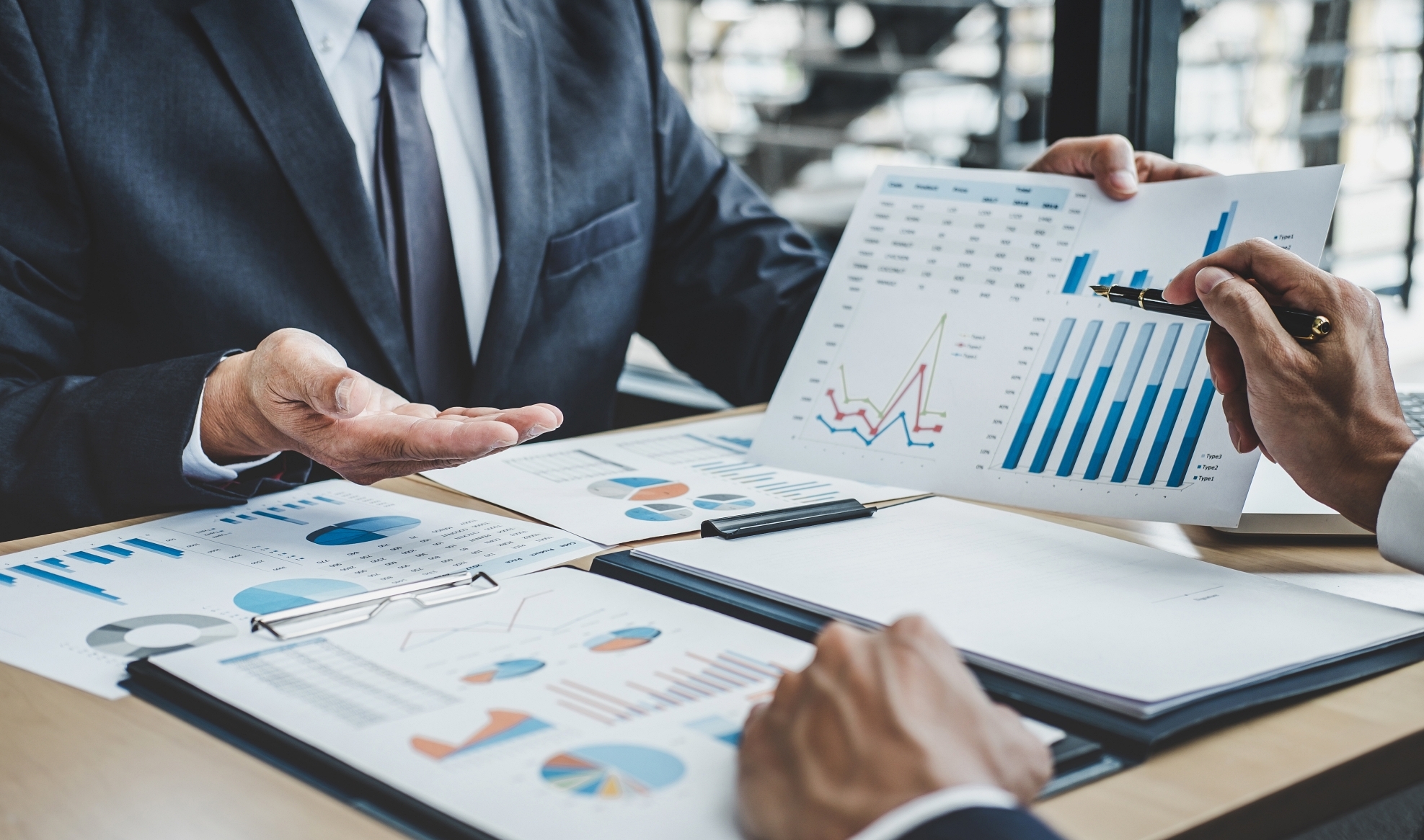 Finance manager meeting discussing company growth project success financial statistics, professional investor working start up project for strategy plan with document, laptop and digital tablet.